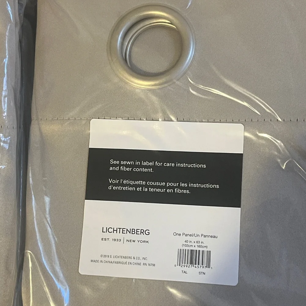 New in package 2 panels of window drapes 40x63”  2 tones gray 6 silver grommets